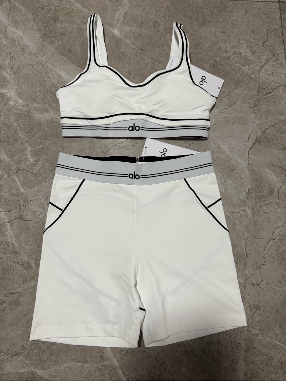 ALO Yoga White Sports Bra and High-Waist Shorts with Black Trim